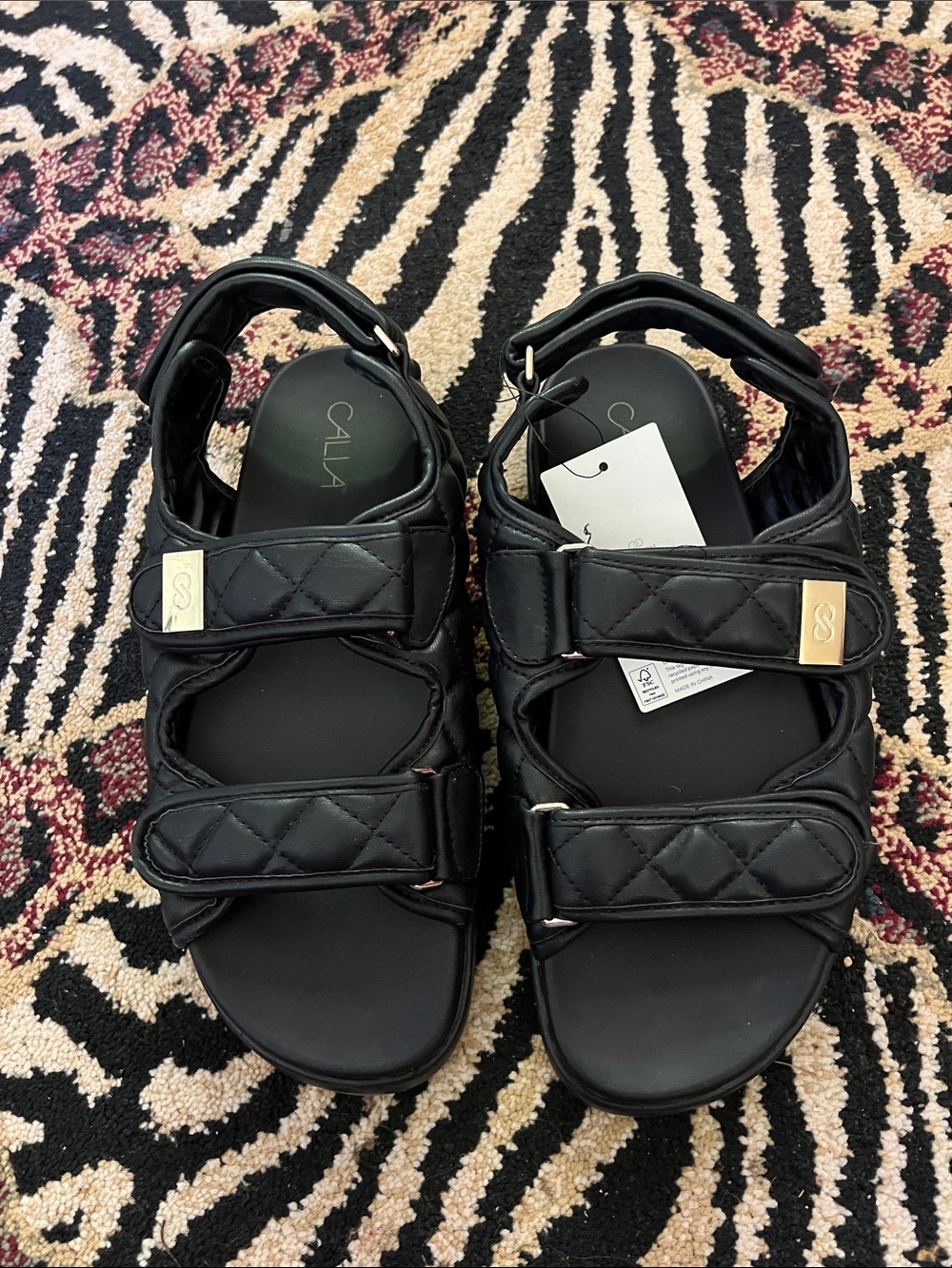 CALIA by Carrie Underwood Quilted Black Strap Sandals with Gold Accents